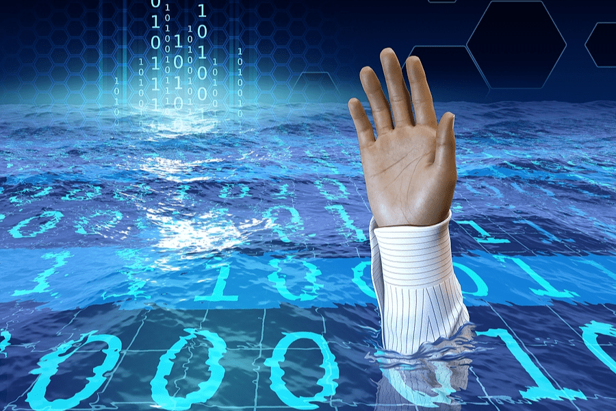 person drowning in data to suggest Information Sprawl