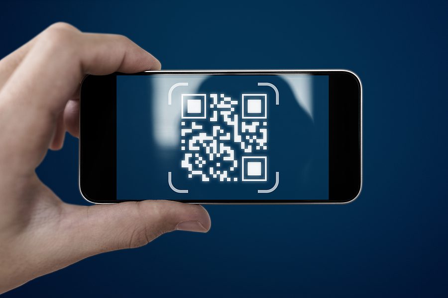 QR code scanning payment and verification. Hand using mobile smart phone scan QR code. One of the changes to M-Files Q4 2023.