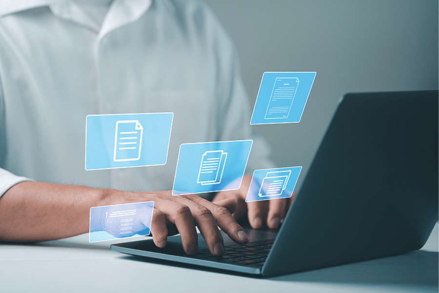 person on laptop with overlay of files, Document Automation
